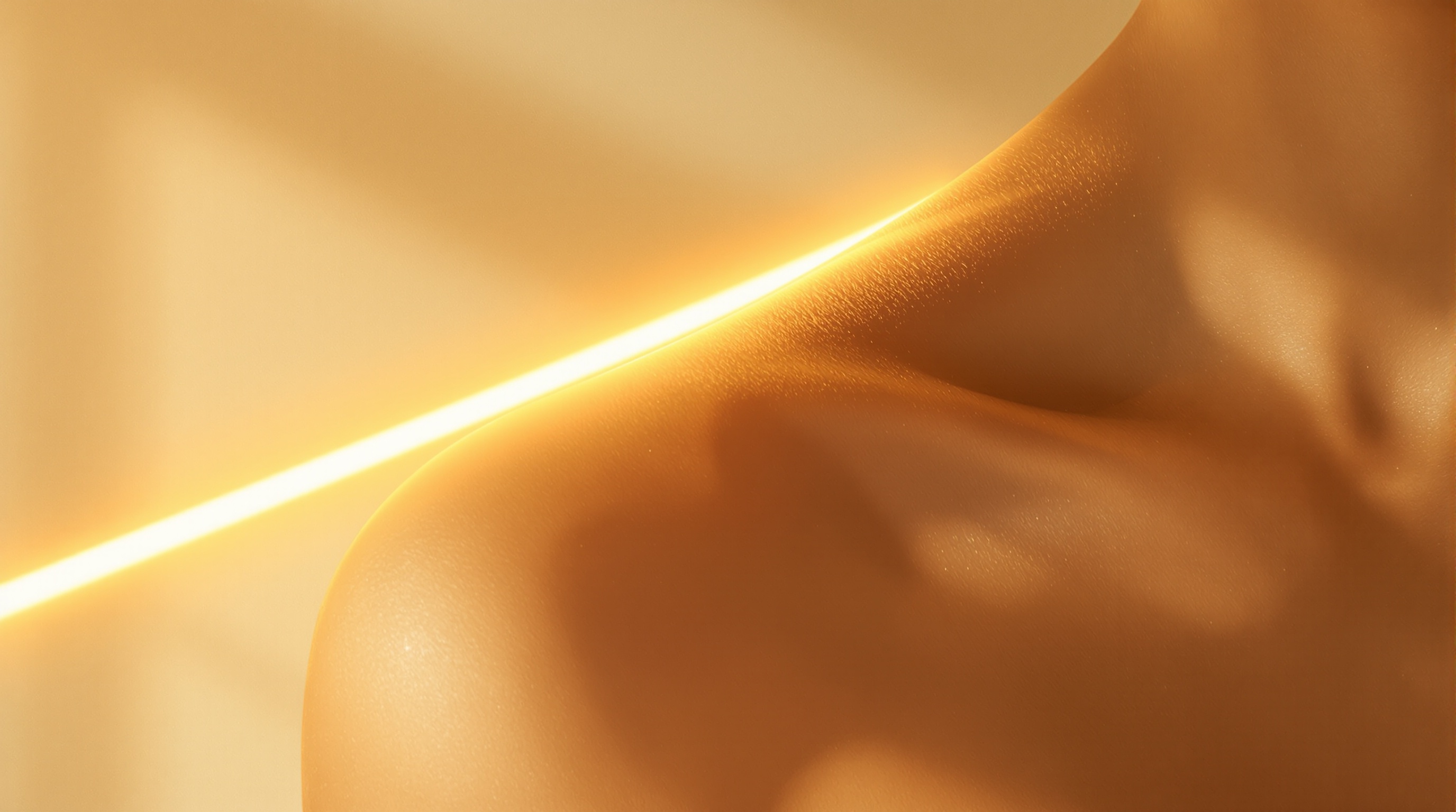 Smooth shoulder and collarbone crossed by a thin band of warm light, evoking a diode laser pass during full body laser hair removal
